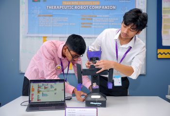 Students collaborating on therapeutic robot companion project